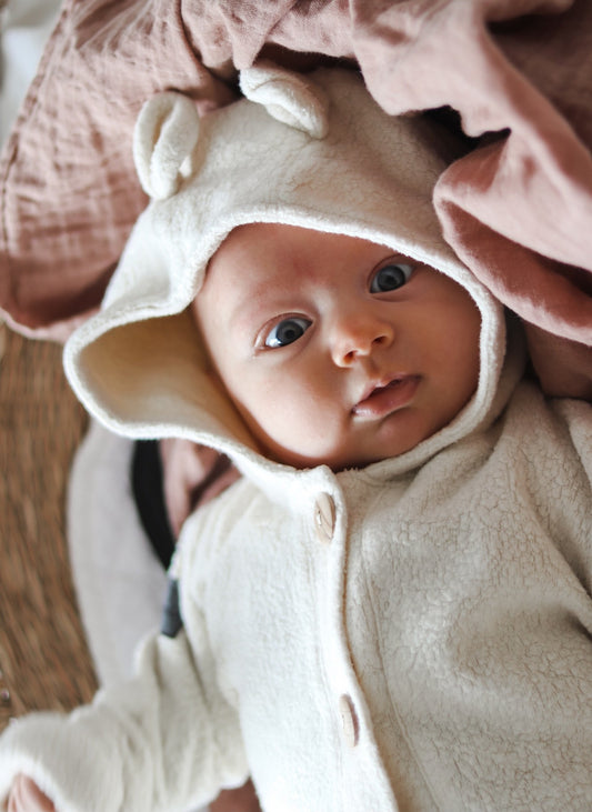 Teplý overal z bio beránku s knoflíky